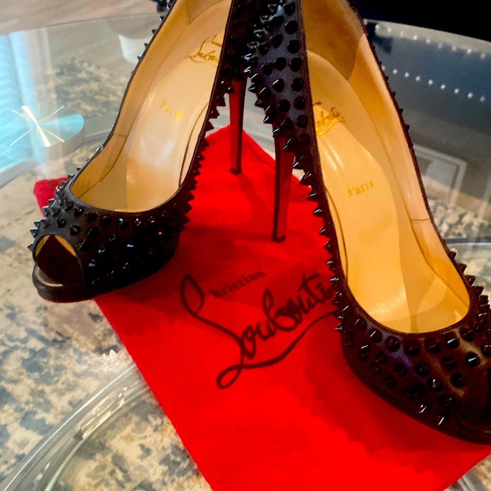 Studded Christian Louboutin heels. Size 41. Size equates to a Size 10.